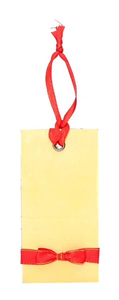 Étiquette cadeau vierge avec arc rouge isolé sur blanc — Photo