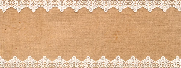 White lace on the sack background — Stock Photo, Image
