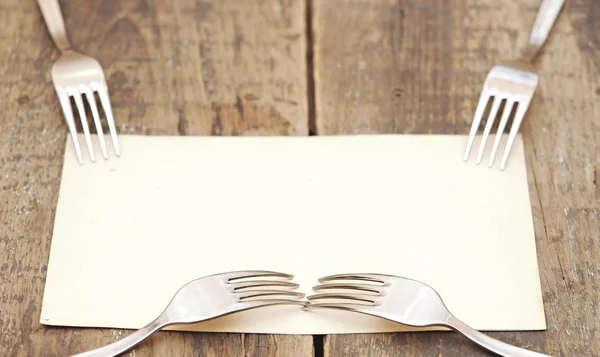 Silver forks on a old paper — Stock Photo, Image