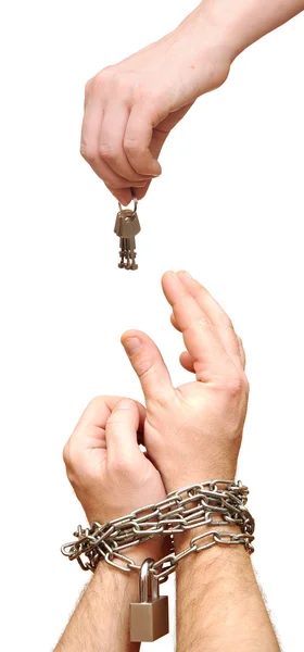 Hand offering keys to another hands in chain — Stock Photo, Image