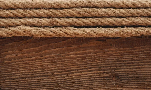 Old texture of wooden boards with ship rope. — Stock Photo, Image