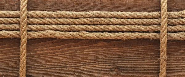 Schip touw en oude hout achtergrondstructuur — Stockfoto