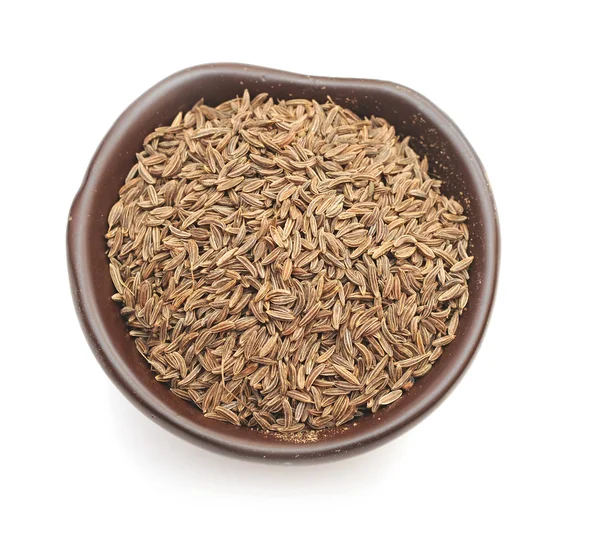 Especias, semillas de comino en un tazón de barro — Foto de Stock