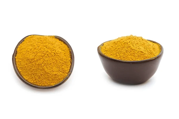 Spezie al curry in una ciotola di argilla — Foto Stock