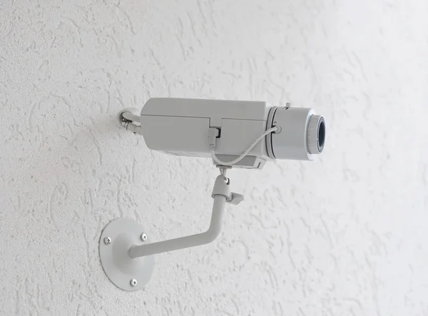 stock image Video camera security system on the wall.