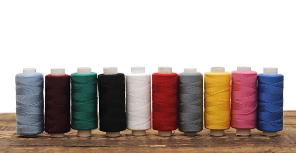 Colorful threads for embroidery on a white background — Stock Photo, Image
