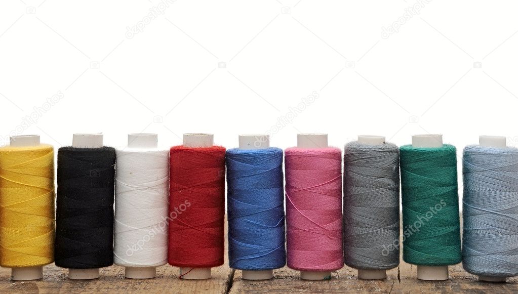 Colorful threads for embroidery on a white background