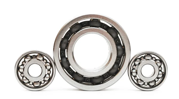 Big and small ball bearings on white background — Stock Photo, Image