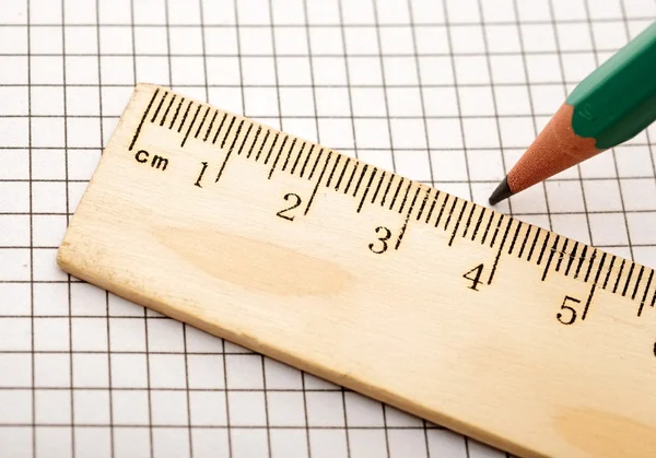Closeup wooden ruler and pencil on background — Stock Photo, Image