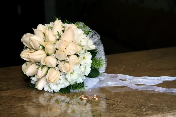 Wedding bouquet, wedding rings. Stock Photo