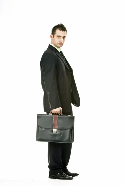 Uomo d'affari in piedi con valigetta — Foto Stock