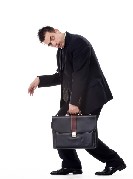 Businessman standing strangely with briefcase — Stock Photo, Image