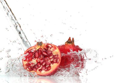 Juicy pomegranate with splashing water clipart