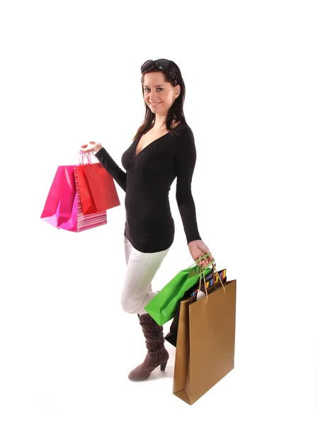 Žena s nákupní tašky přes bílý — Stock fotografie