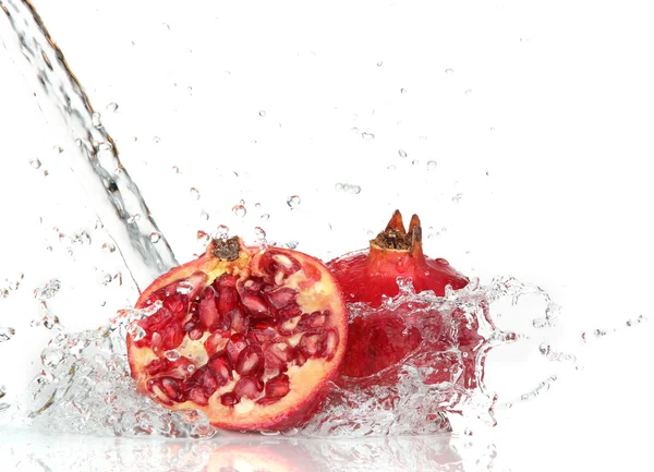 Juicy pomegranate with splashing water — Stock Photo, Image