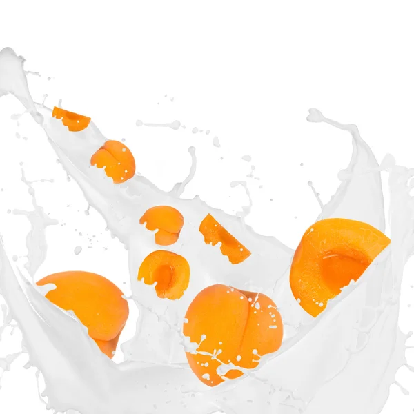 Apricots in cream splash — Stock Photo, Image