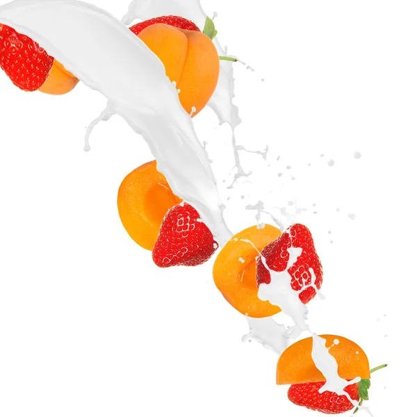 Fruit in milk splash — Stock Photo, Image