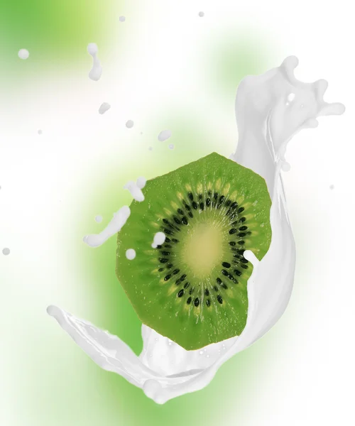 Kiwi in milk splash — Stock Photo, Image