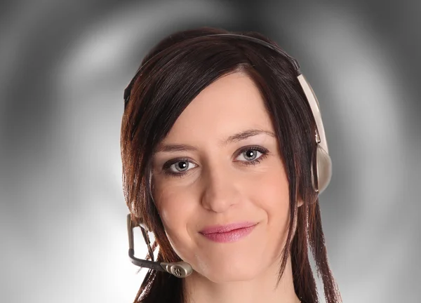 Operador mulher bonita com fone de ouvido — Fotografia de Stock