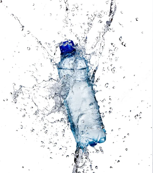 Fresh water splashing out of bottle — Stock Photo, Image