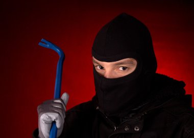 Burglar with black cowl clipart