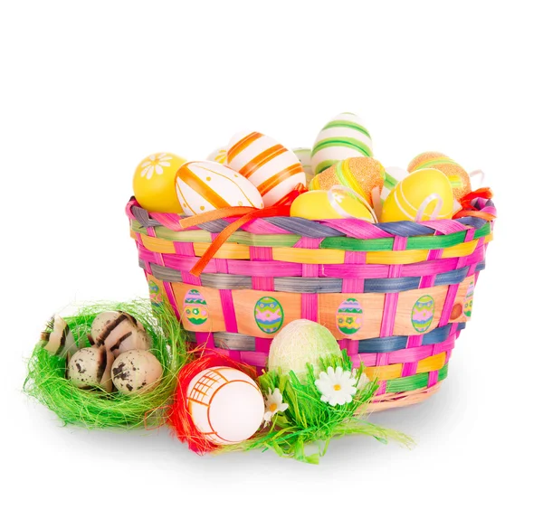 Colorful painted easter eggs in a basket — Stock Photo, Image