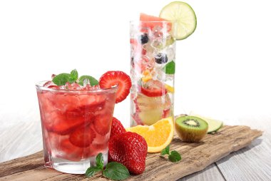 Fruit drink on wooden background clipart