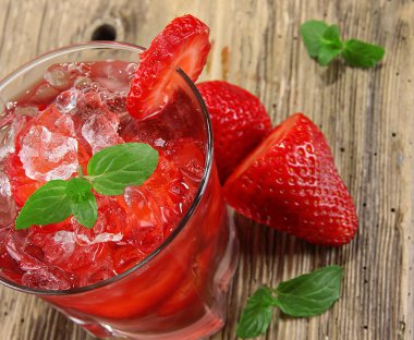 Fresh strawberry drink on wood background clipart