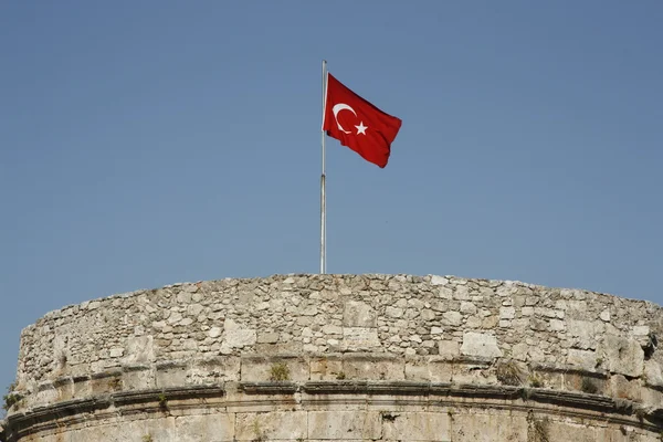 Ancient fortress with Turkish flag — Stock Photo, Image