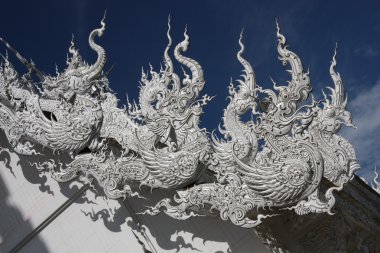 Roof sculptures with Thai dragons, Thailand clipart