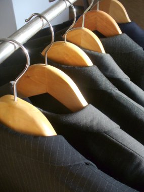 Row of men's suit jackets clipart