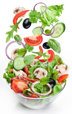 Flying vegetables - salad ingredients. clipart