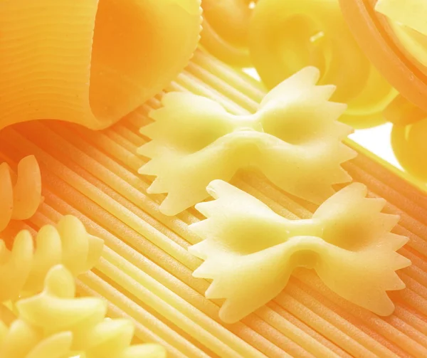 Close up shoot of different types of raw pasta. — Stock Photo, Image
