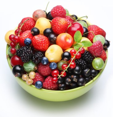 Different berries in the bowl. clipart