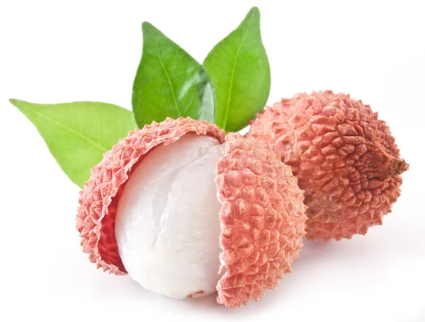 Lychee with leaves on a white background. — Stock Photo, Image