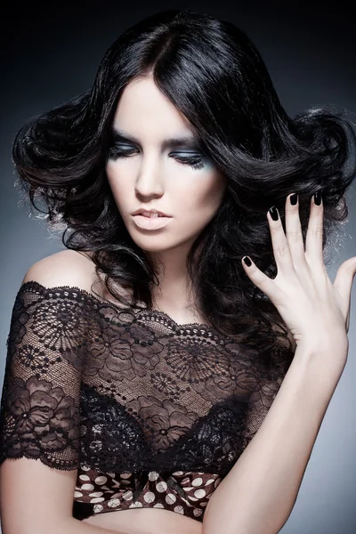 Black hair young woman portrait with an original colour make-up, studio shot — Stock Photo, Image