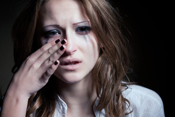 Crying young girl isolated