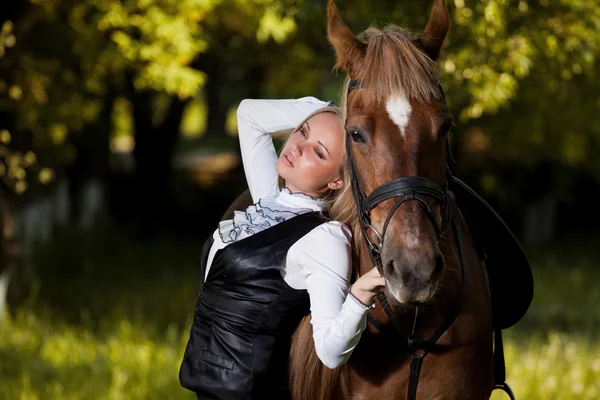 stock image Walk of beautiful young girl with a horse