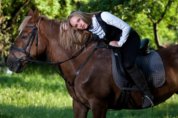 stock image Walk of beautiful young girl with a horse