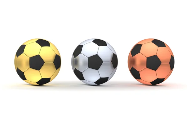 Три футбольных мяча в ряд - золото, серебро, бронза — стоковое фото