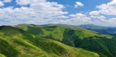 Mountain ridges covered with meadows clipart