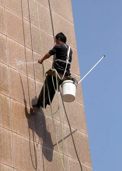 Stock image Worker on the wall