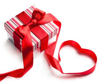 Art gift box with red ribbon in heart shape isolated on white ba clipart