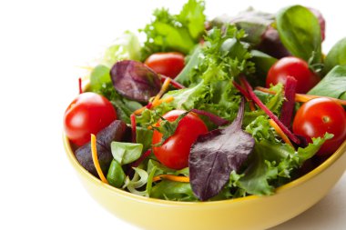 Bowl of fresh green salad with tomatoes clipart