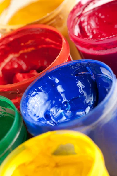 Colourful paints and paintbrushes — Stock Photo, Image