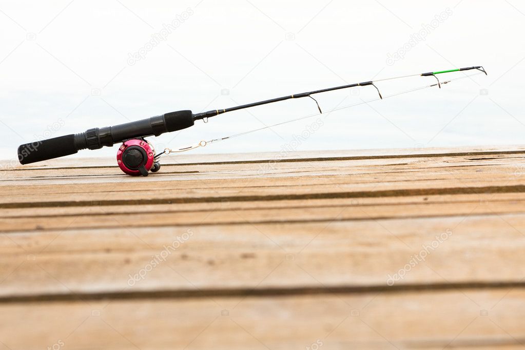 Fishing rod and reel on a deck