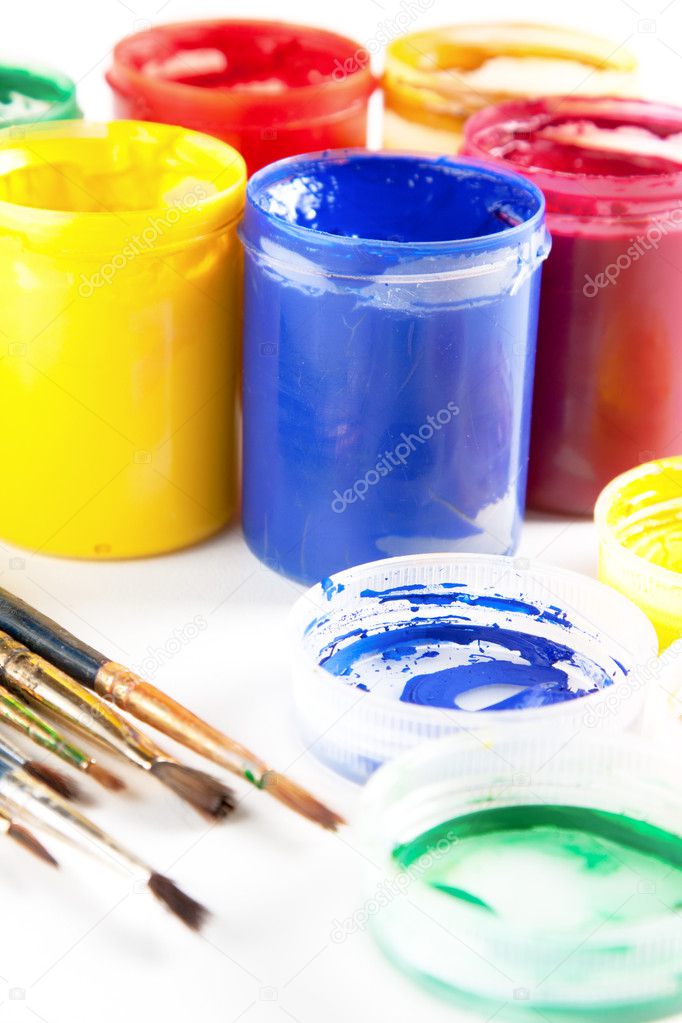 Colourful paints and paintbrushes