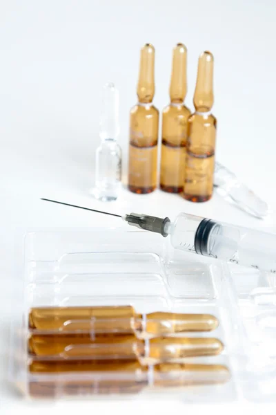 Close-up shot of syringe and vials — Stock Photo, Image
