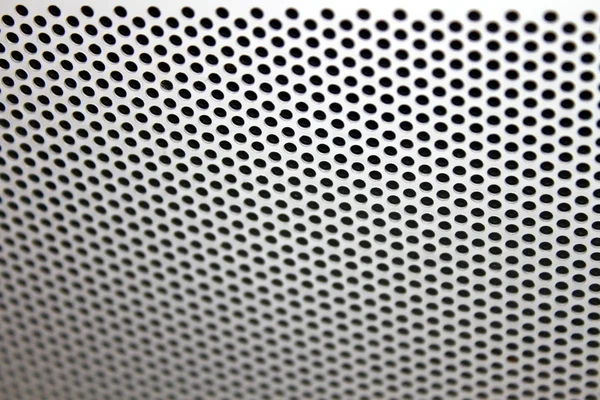 stock image A background of circular indentations in metal.