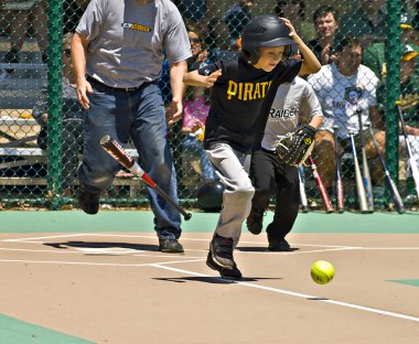 Young Batter Running to First Base clipart